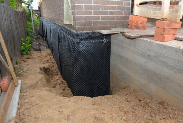Happy homeowners after waterproofing job in Huntington Station